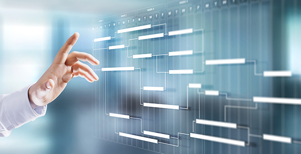 Hand pointing to digital mind map made with mind mapping software.