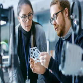 Female and male engineer analyzing the reliability of the design of a product.